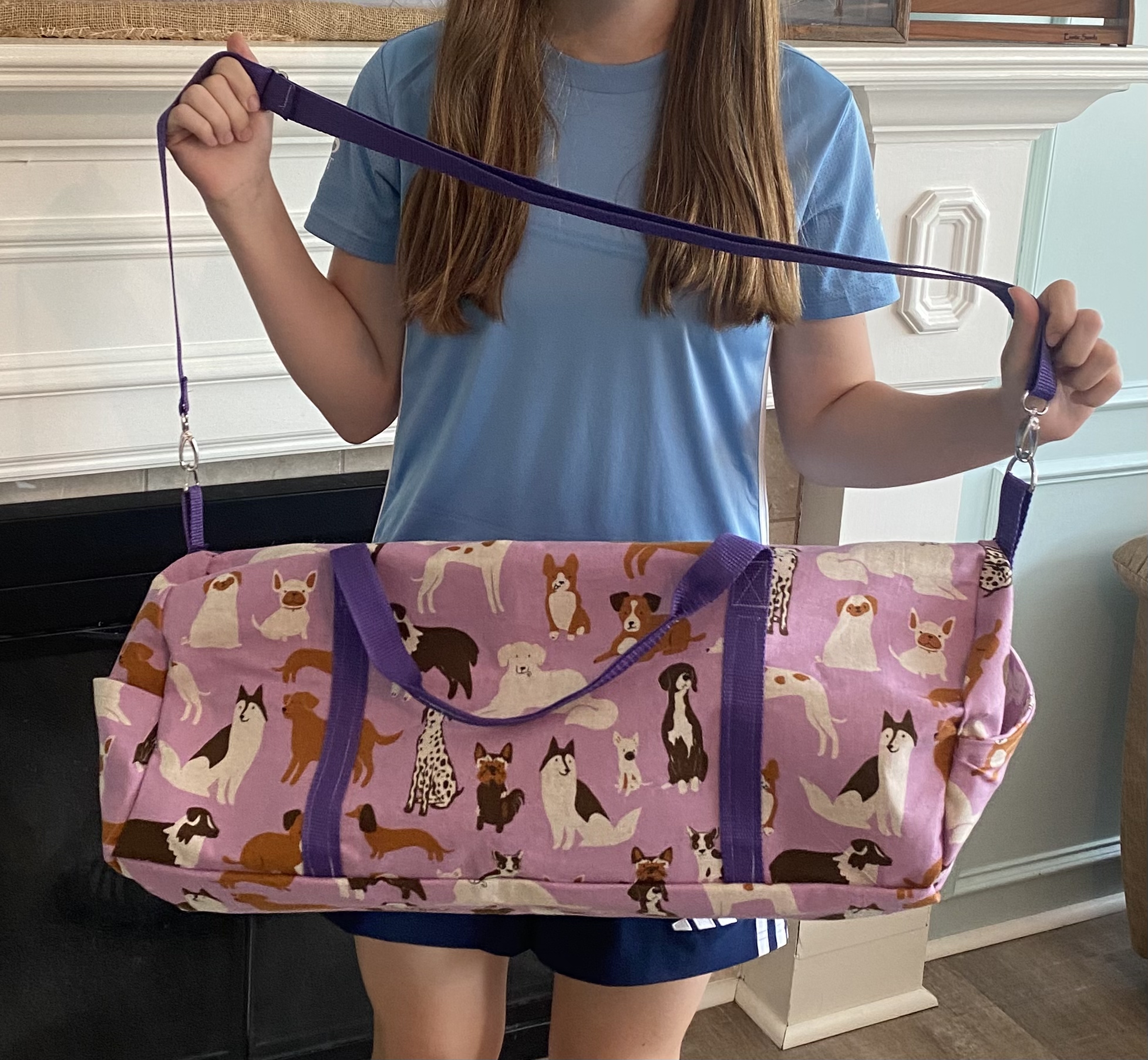 Girl carrying a large duffle bag she made